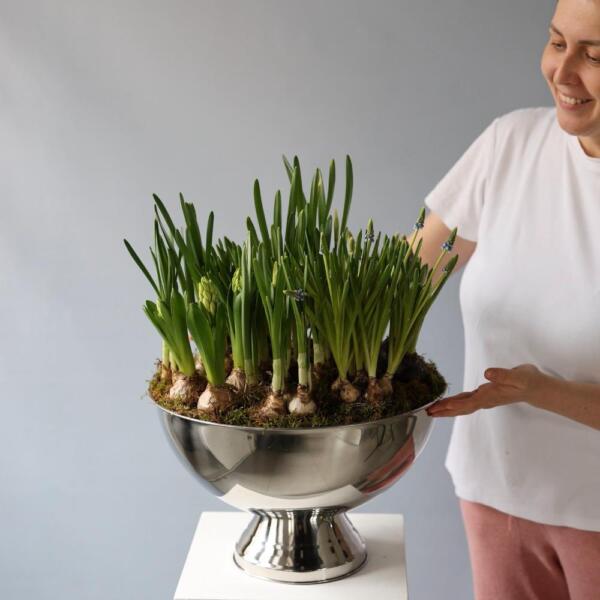 Spring flowers in a metal bowl