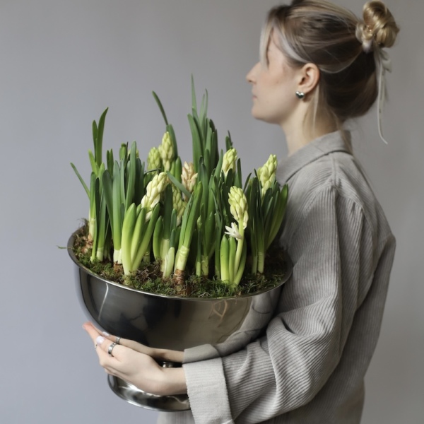 Spring flowers in a metal bowl