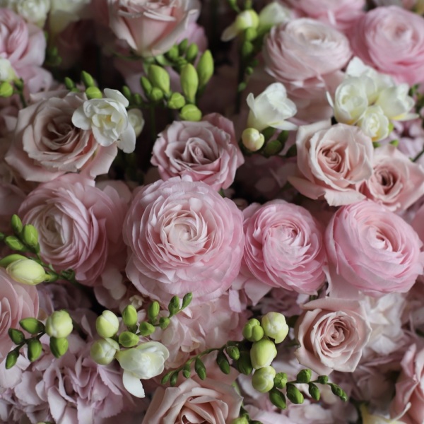 Basket with Ranunculus, Freesia, Hydrangeas and Roses