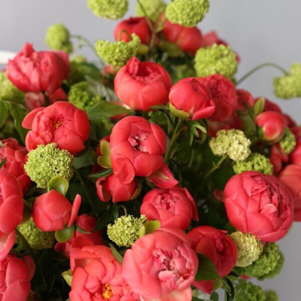 Basket with peonies and viburnum