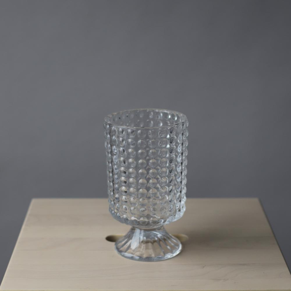 Ribbed vase with a leg